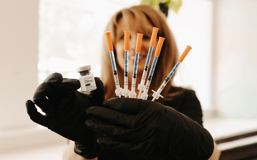 Nurse holding peptide shots